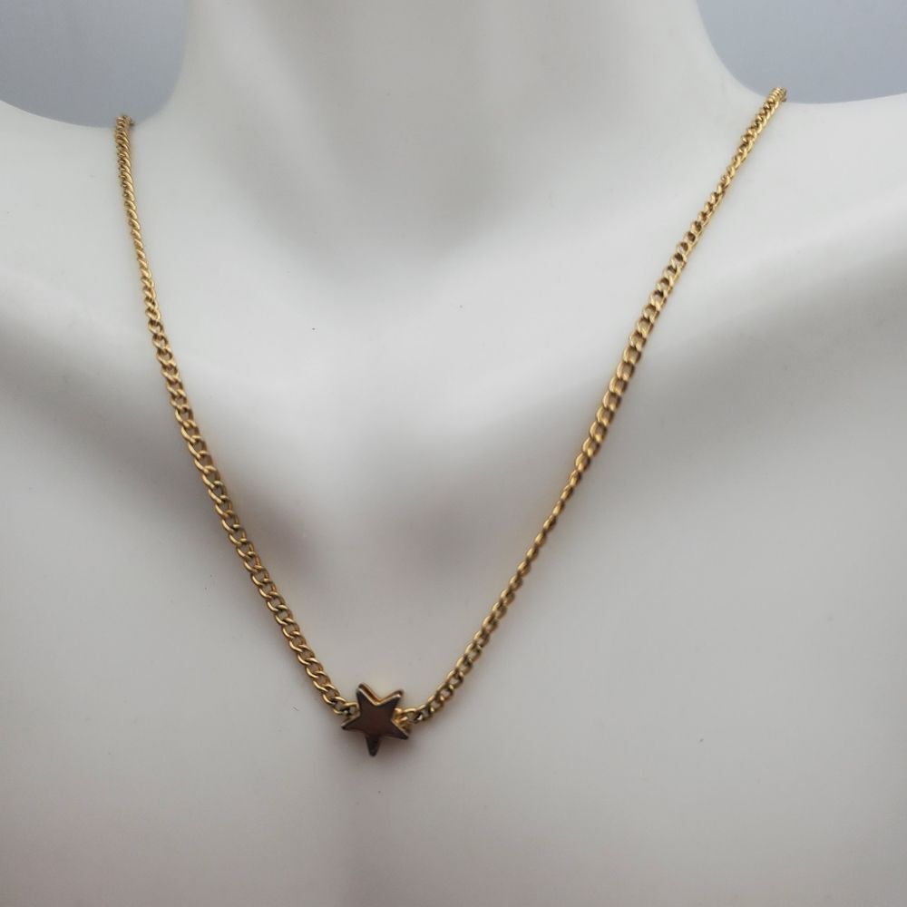 Single shooting star gold toned necklace‎